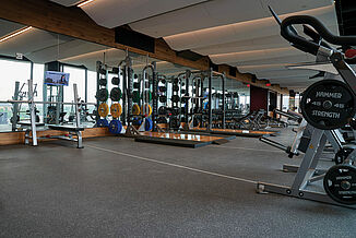 A close-up view of the gray flooring in the fitness center, showcasing its texture and color.