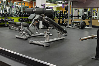 View of the various benches and equipment located in Anytime Fitness in Fairmount Philadelphia.