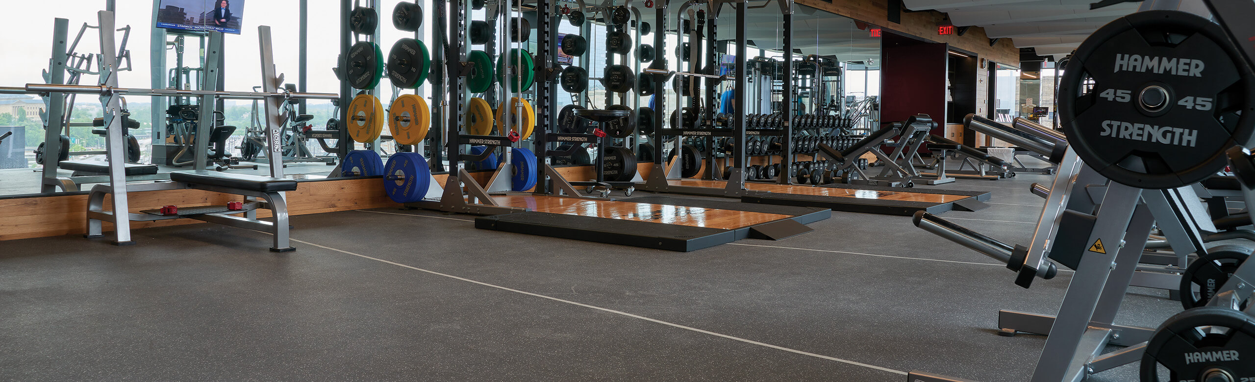 A close-up view of the gray flooring in the fitness center, showcasing its texture and color.